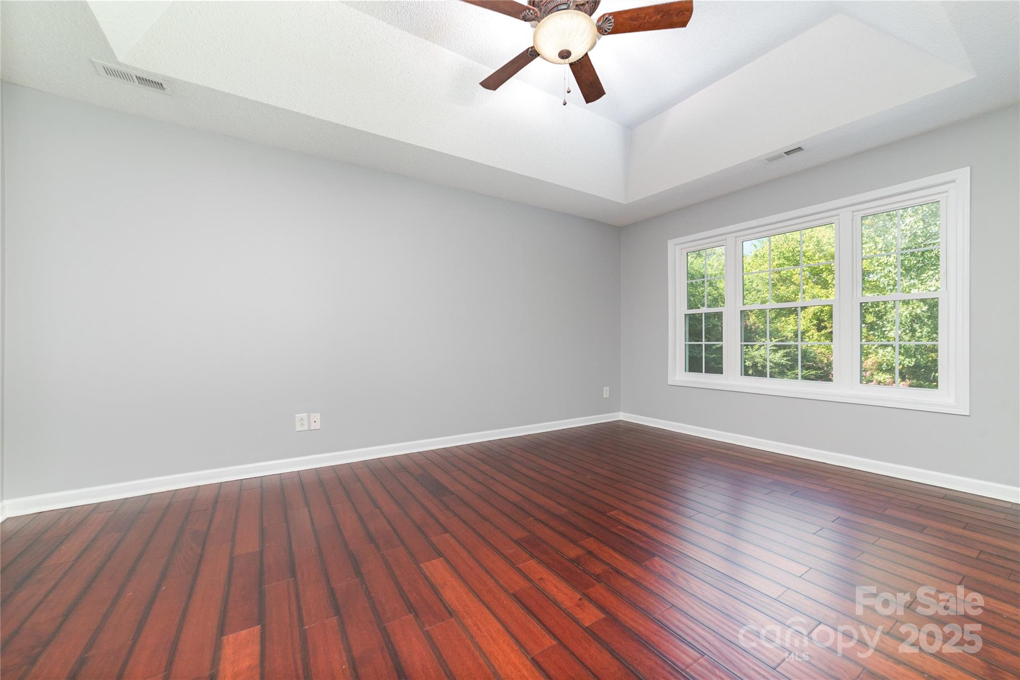200 Sidney Court Monroe, NC 28110 - Photo 8 of 18 wooden floor in an empty room with a window