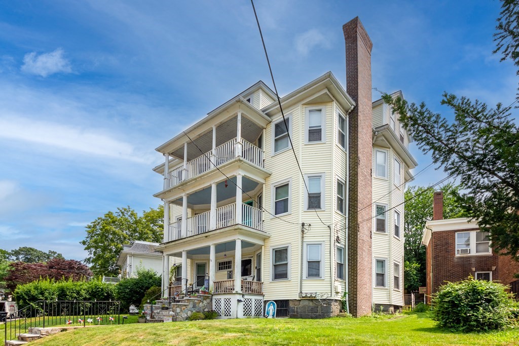33 Oak Street Boston, MA 02136 - Photo 3 of 18 a view of a white building among the garden