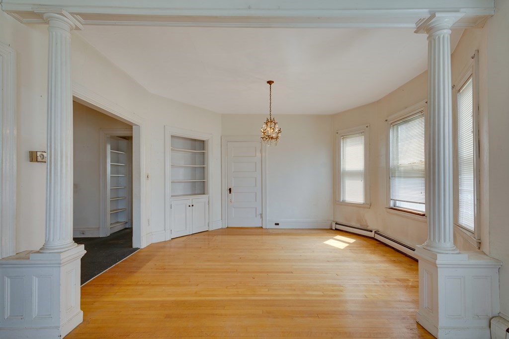 33 Oak Street Boston, MA 02136 - Photo 8 of 18 a view of empty room with wooden floor and fan