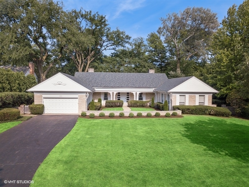 1000 Romona Road Wilmette, IL 60091 - Photo 2 of 4 a front view of a house with yard and green space