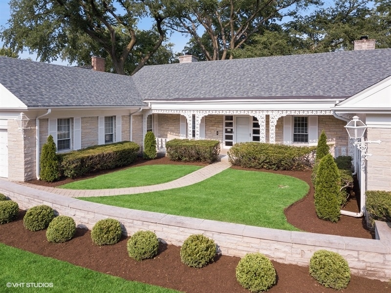 1000 Romona Road Wilmette, IL 60091 - Photo 4 of 4 a front view of a house with a garden and yard
