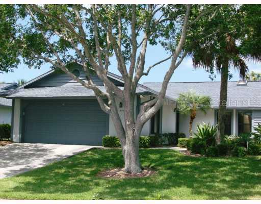 1684 Pintail Way Sarasota, FL 34231 - Photo 1 of 1 a front view of a house with garden