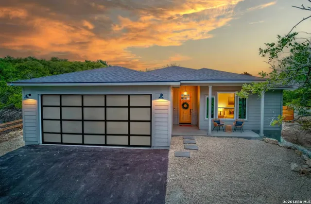 a front view of a house with a garage