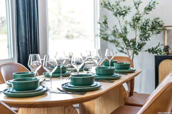 a view of a dining room with furniture window and outside view