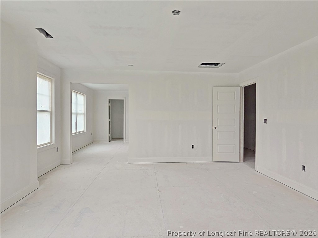 2650 Norrington Road Lillington, NC 27546 - Photo 17 of 24 a view of an empty room with a window