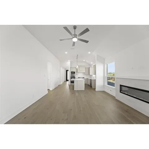 a kitchen with kitchen island a sink stainless steel appliances and cabinets