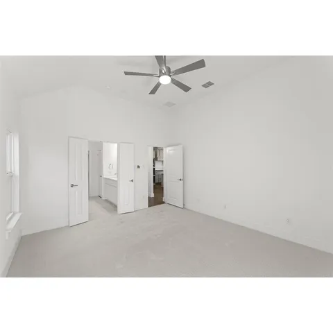 a bathroom with a tub sink shower and mirror