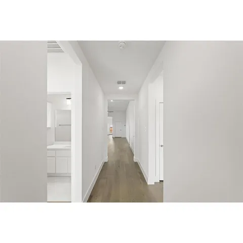 a open hall with a white wall