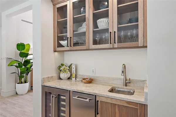 a kitchen with a sink and cabinets