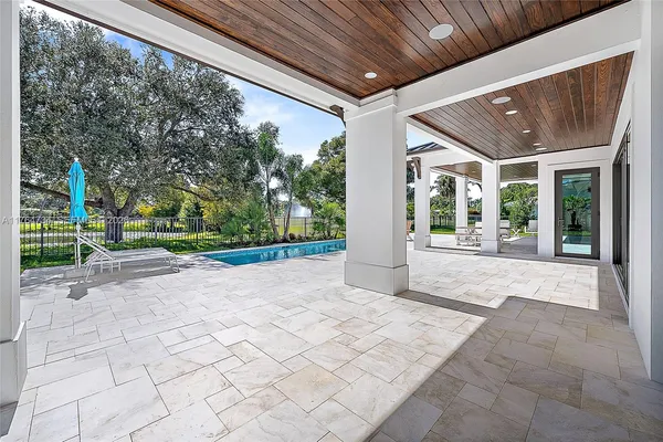 a living room with furniture potted plant and a rug
