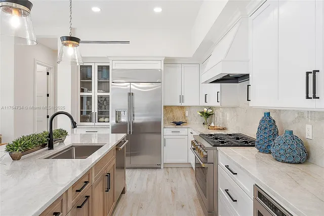 a bedroom with a large bed and a large window
