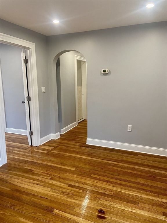 25 Clark Street, Unit 1 Arlington, MA 02476 - Photo 6 of 10 a view of a room with wooden floor and entrance