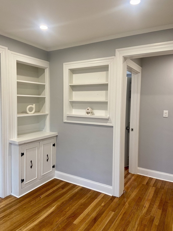 25 Clark Street, Unit 1 Arlington, MA 02476 - Photo 8 of 10 a view of an empty room with wooden floor and a window