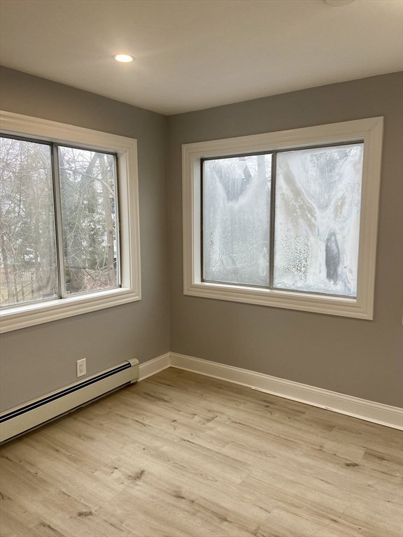 25 Clark Street, Unit 1 Arlington, MA 02476 - Photo 9 of 10 a view of an empty room with a window