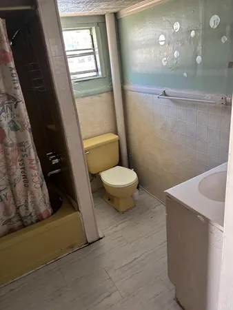 a bathroom with a sink a toilet and vanity