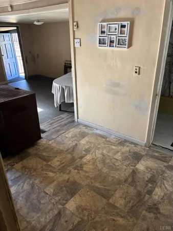 a view of an empty room and a window
