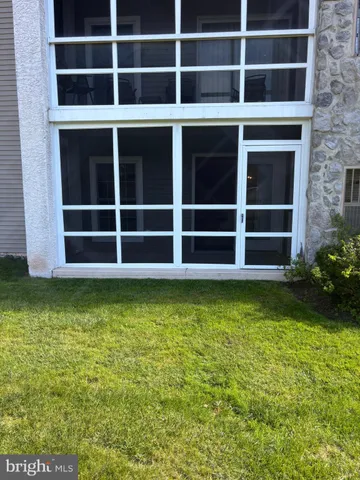 a view of a house with a large window