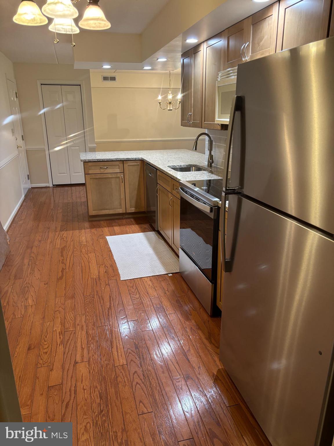 620 Brandon Road Norristown, PA 19403 - Photo 3 of 19 a kitchen with kitchen island wooden floors appliances and cabinets