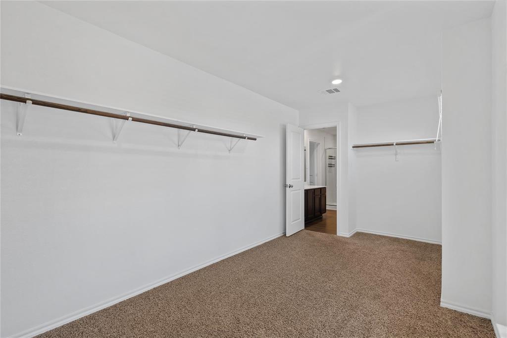 1287 Delmita Drive, Unit 1287 Forney, TX 75126 - Photo 8 of 23 Unfurnished bedroom with carpet and a closet