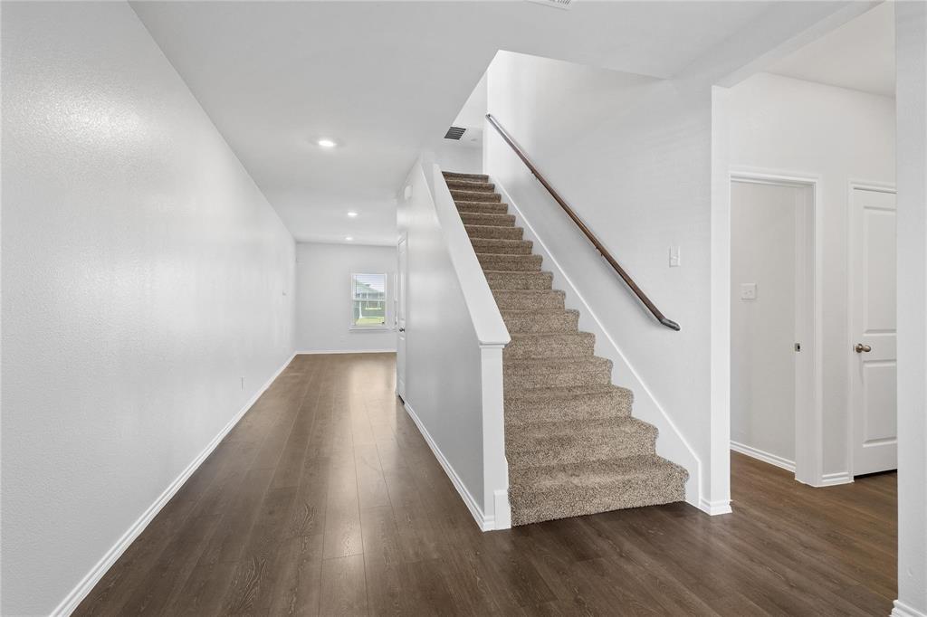1287 Delmita Drive, Unit 1287 Forney, TX 75126 - Photo 3 of 23 Stairs featuring wood finished floors and recessed lighting