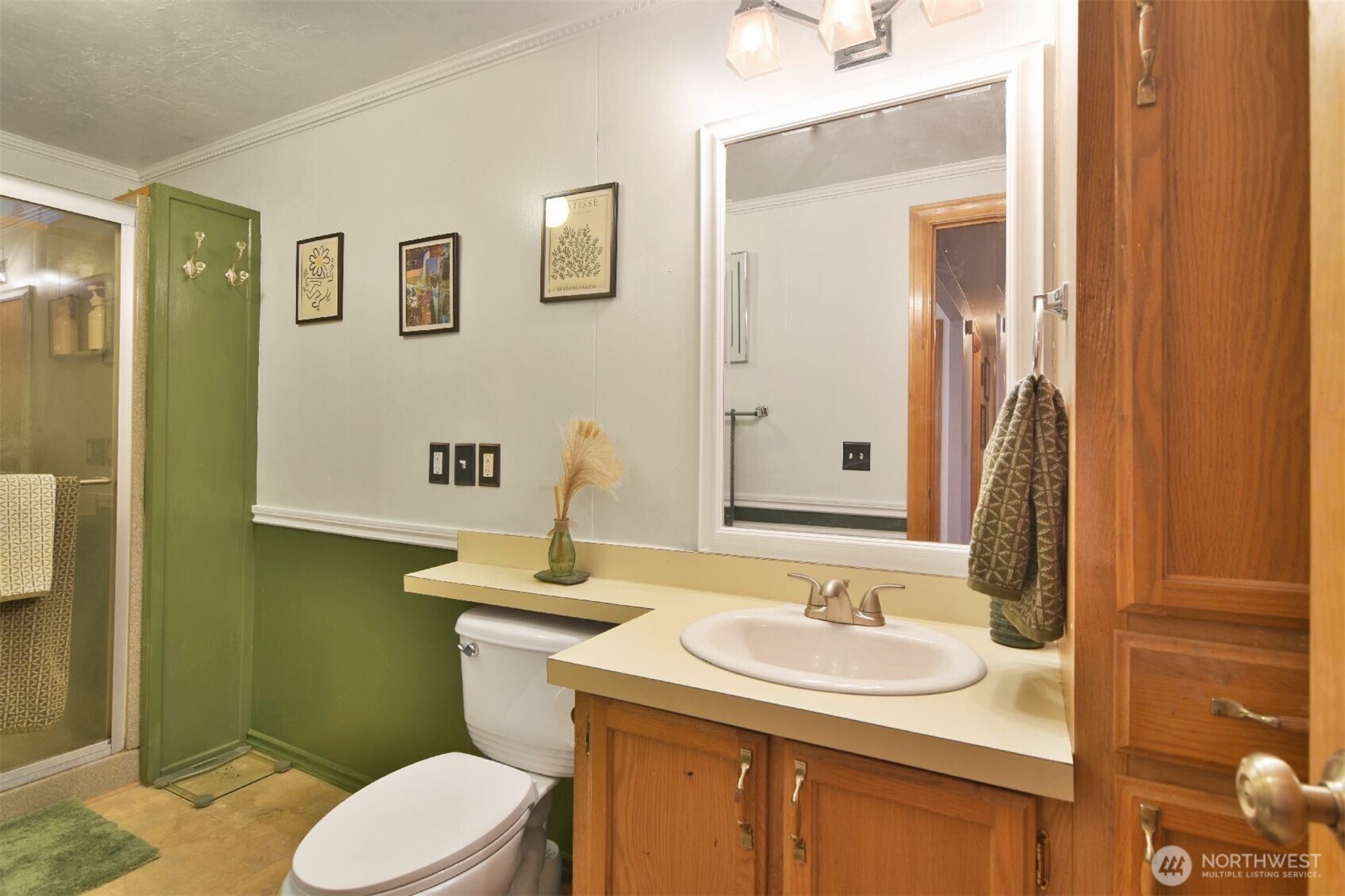 12611 Northeast 197th Street Bothell, WA 98011 - Photo 17 of 30 a bathroom with a sink and a mirror