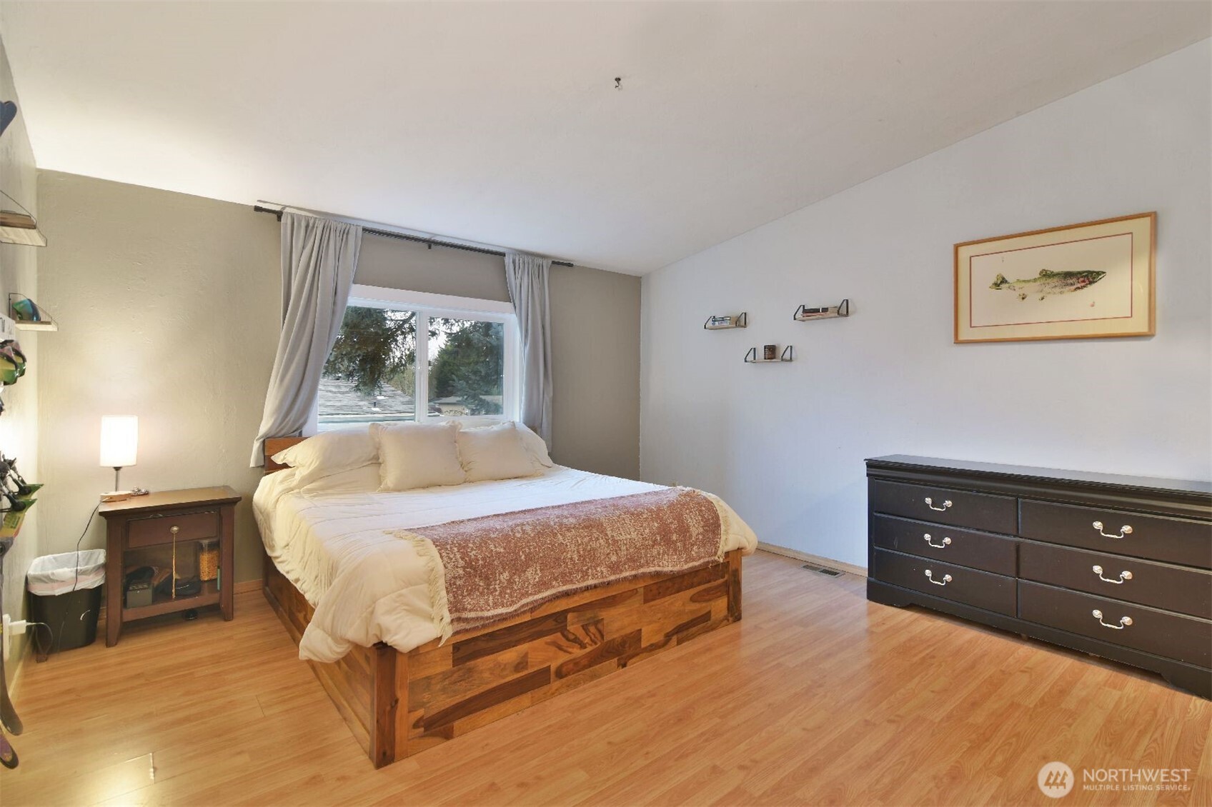 12611 Northeast 197th Street Bothell, WA 98011 - Photo 19 of 30 a bedroom with a bed and a dresser