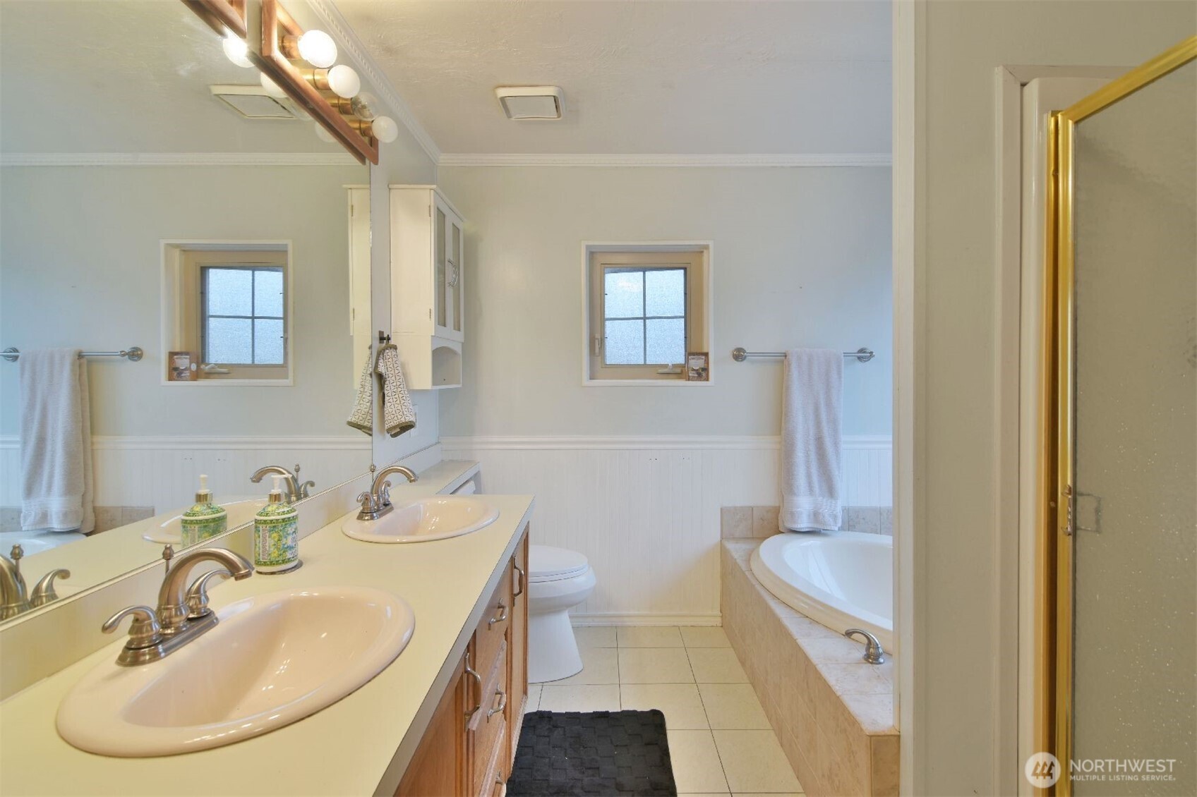 12611 Northeast 197th Street Bothell, WA 98011 - Photo 22 of 30 a bathroom with a sink and a mirror
