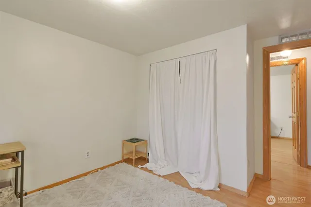 wooden floor and utility room in closet