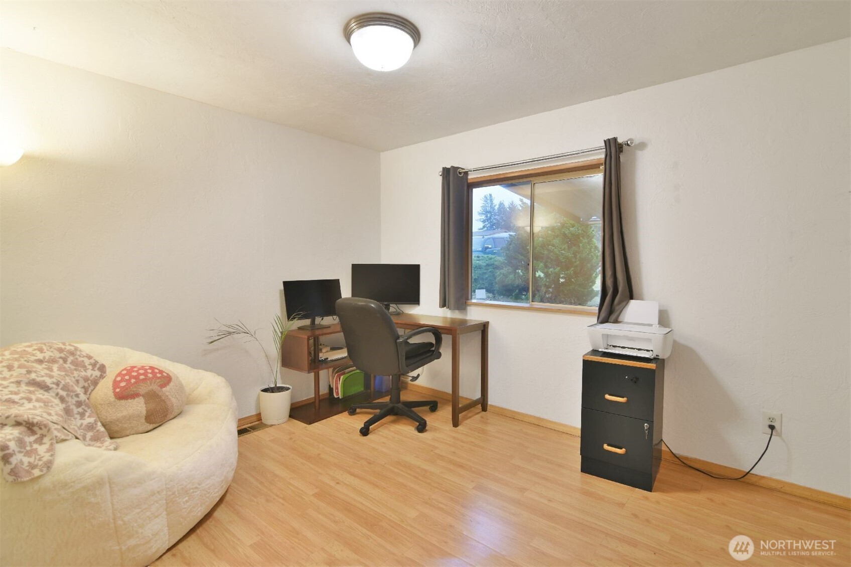 12611 Northeast 197th Street Bothell, WA 98011 - Photo 25 of 30 a view of a workspace with furniture and a window