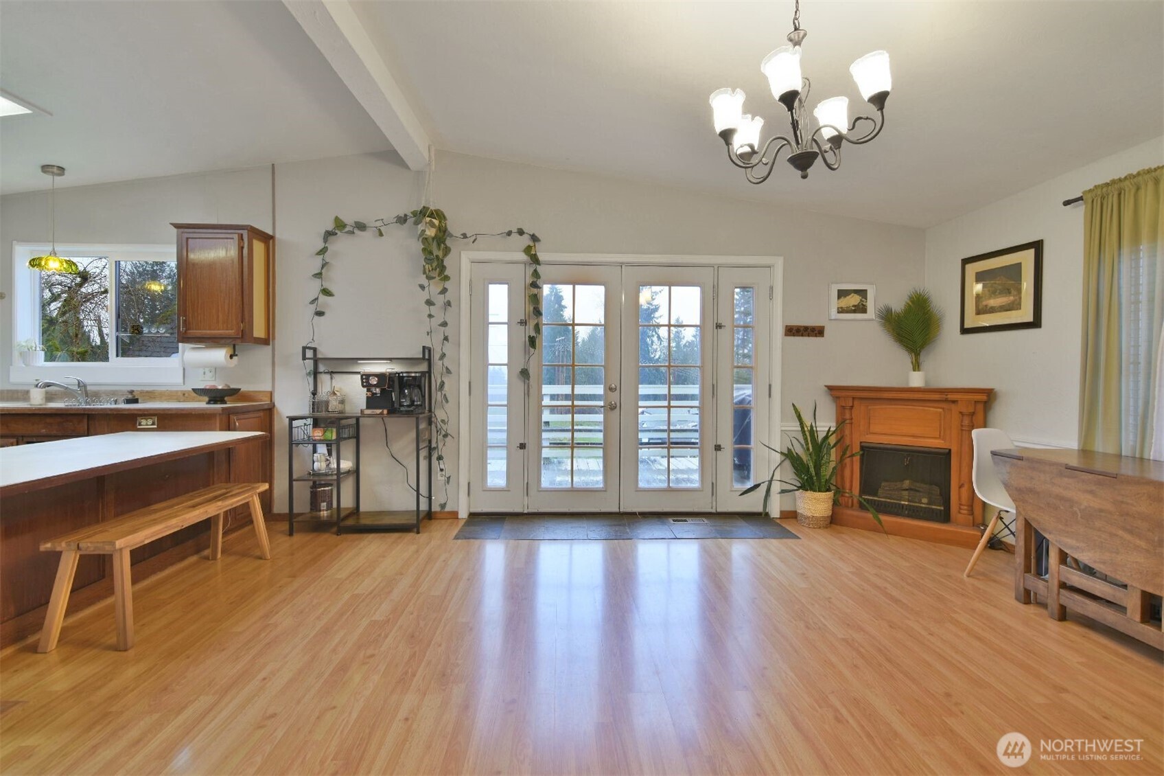 12611 Northeast 197th Street Bothell, WA 98011 - Photo 5 of 30 a view of a livingroom with furniture a dinning room and wooden floor