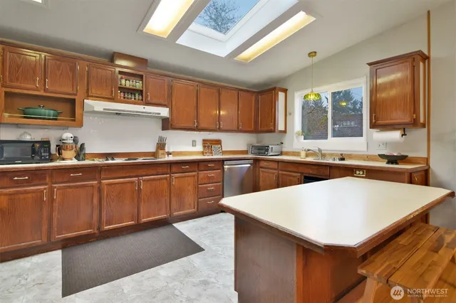 a view of a kitchen with furniture and a chandelier