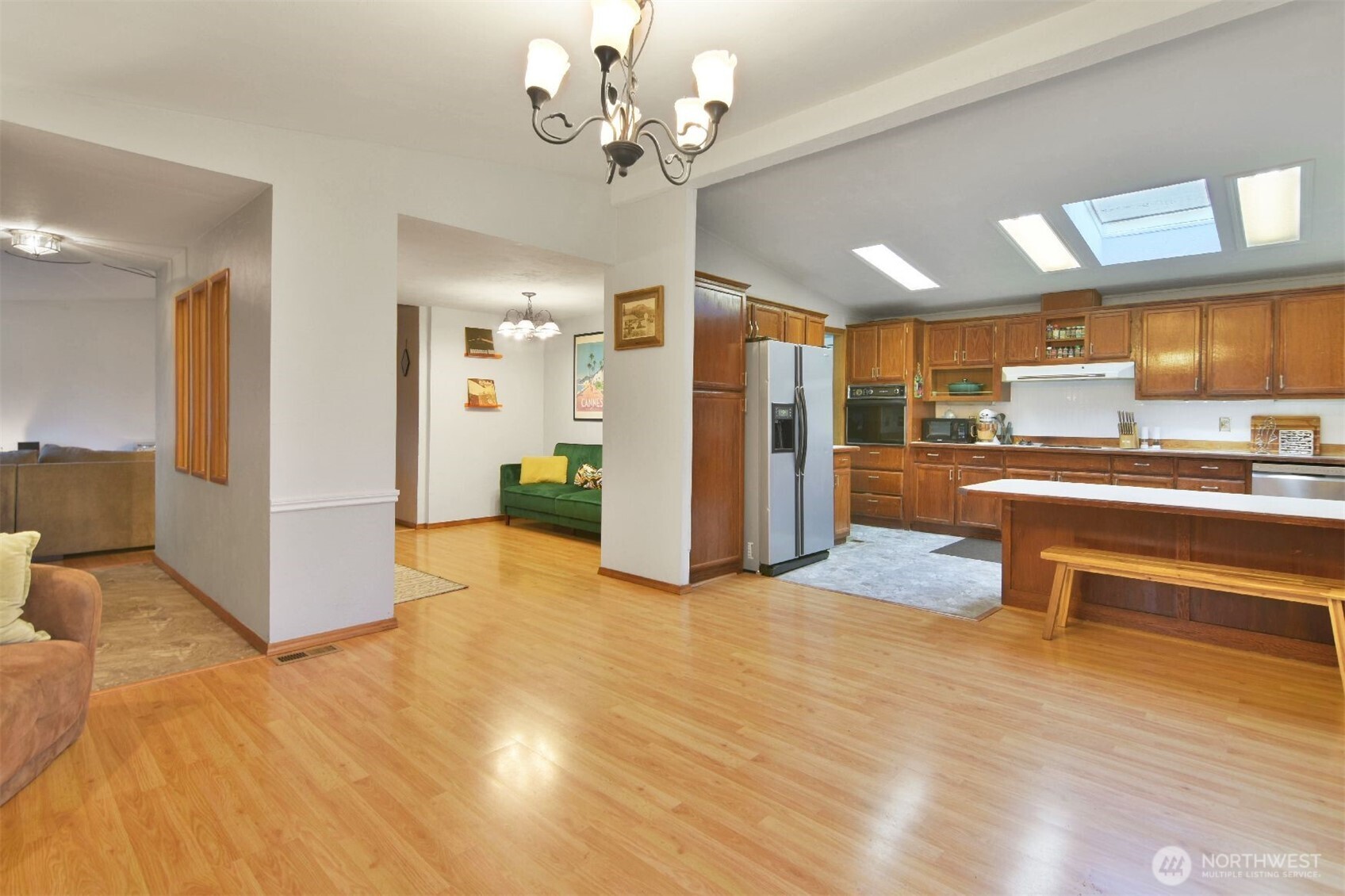 12611 Northeast 197th Street Bothell, WA 98011 - Photo 10 of 30 a view of a kitchen with furniture and a chandelier