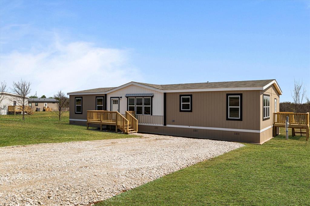 3924 Sandusky Road Whitesboro, TX 76273 - Photo 4 of 40 Manufactured / mobile home featuring crawl space, a front yard, and a deck