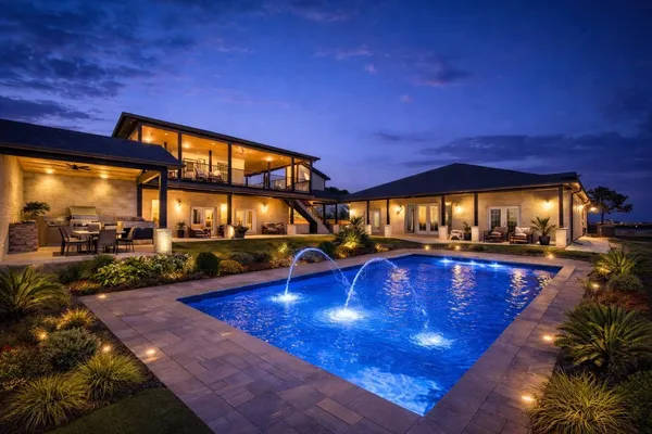 a view of a swimming pool with seating space