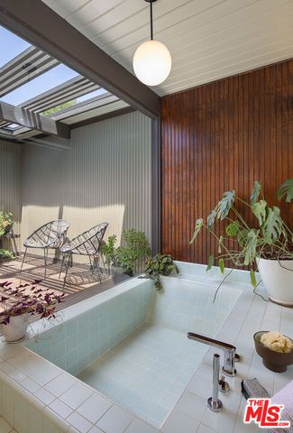 a bathroom with a sink mirror and vanity
