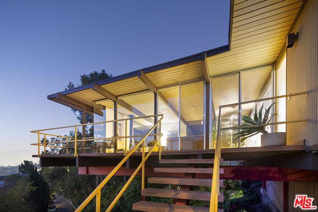 a view of balcony and with a floor to ceiling window and potted plants