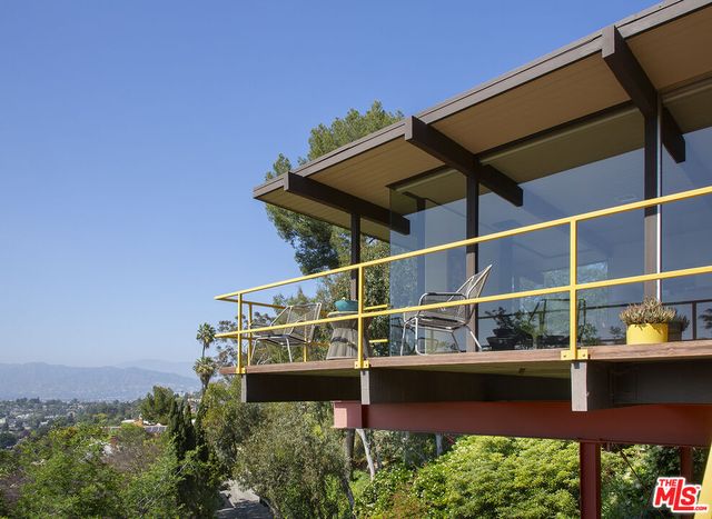 a view of balcony with furniture
