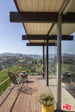 a view of balcony with a potted plant