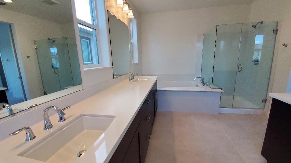 Pastoral Loop San Jose, CA 95122 - Photo 11 of 14 a bathroom with a tub sink and mirror