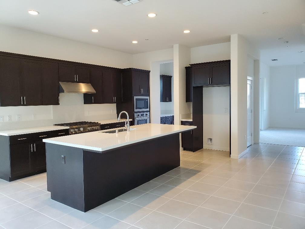 Pastoral Loop San Jose, CA 95122 - Photo 6 of 14 a kitchen with stainless steel appliances a sink stove and refrigerator