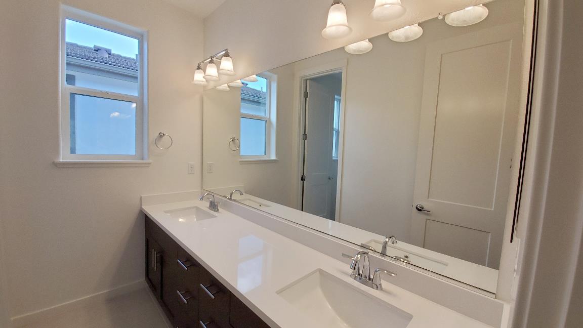 Pastoral Loop San Jose, CA 95122 - Photo 10 of 14 a bathroom with a sink a vanity and a mirror