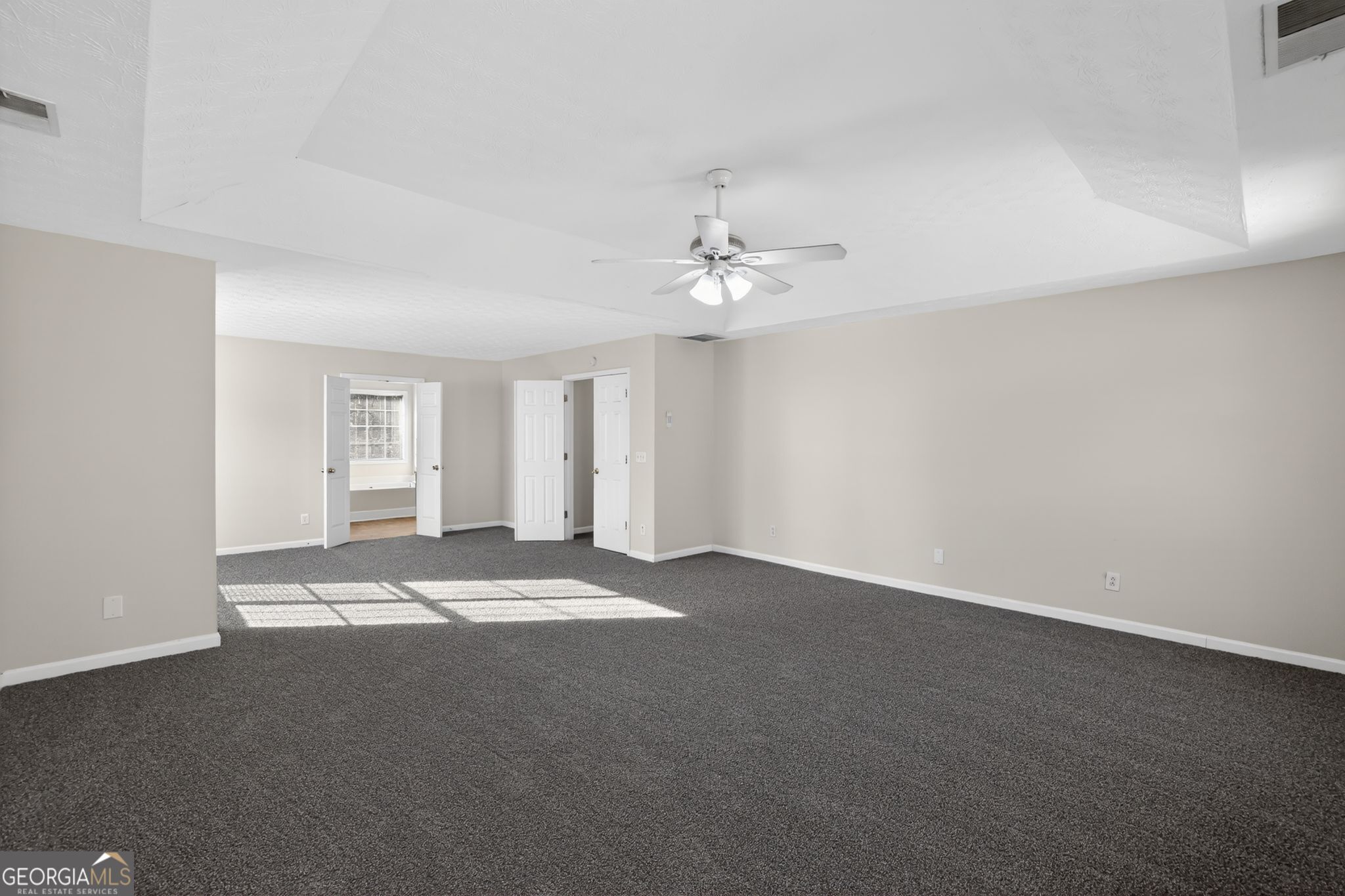 4375 Conley Landing Conley, GA 30288 - Photo 17 of 34 a view of an empty room with a chandelier fan