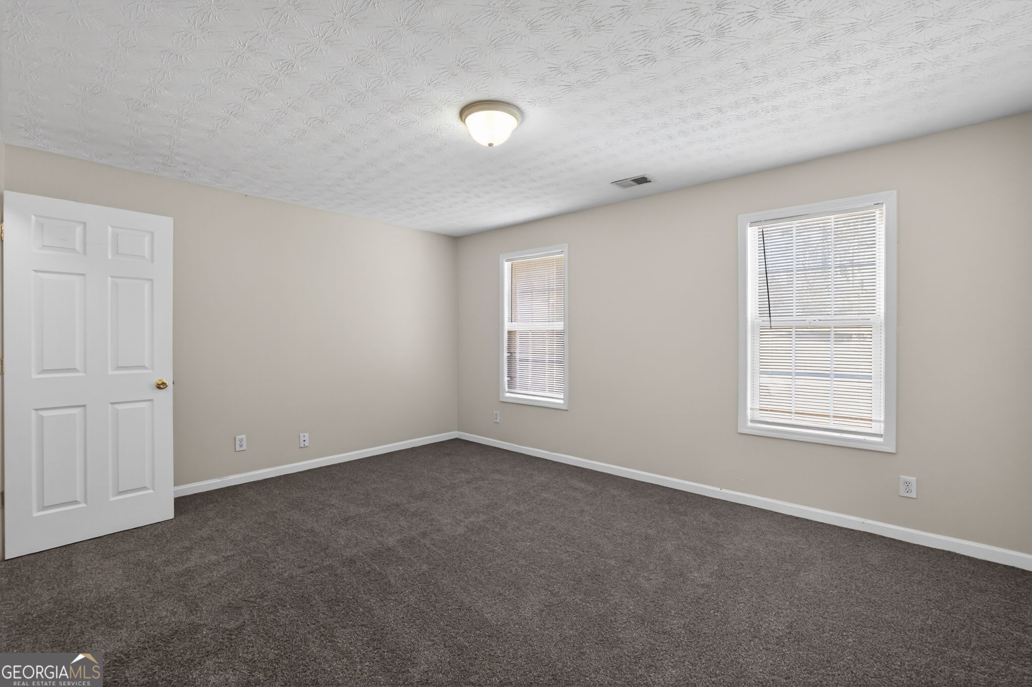 4375 Conley Landing Conley, GA 30288 - Photo 18 of 34 an empty room with windows and closet