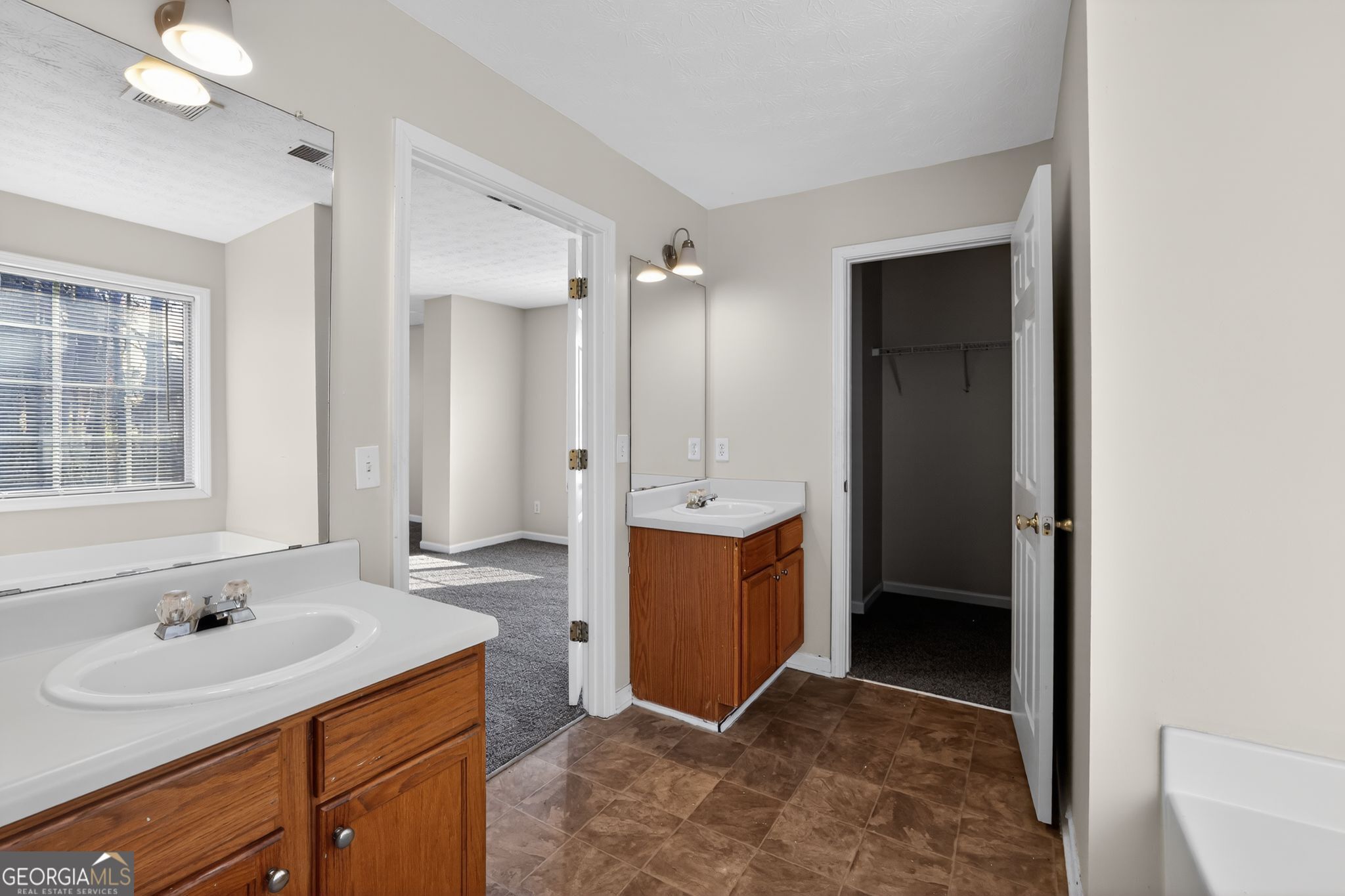 4375 Conley Landing Conley, GA 30288 - Photo 26 of 34 a bathroom with a sink and a mirror