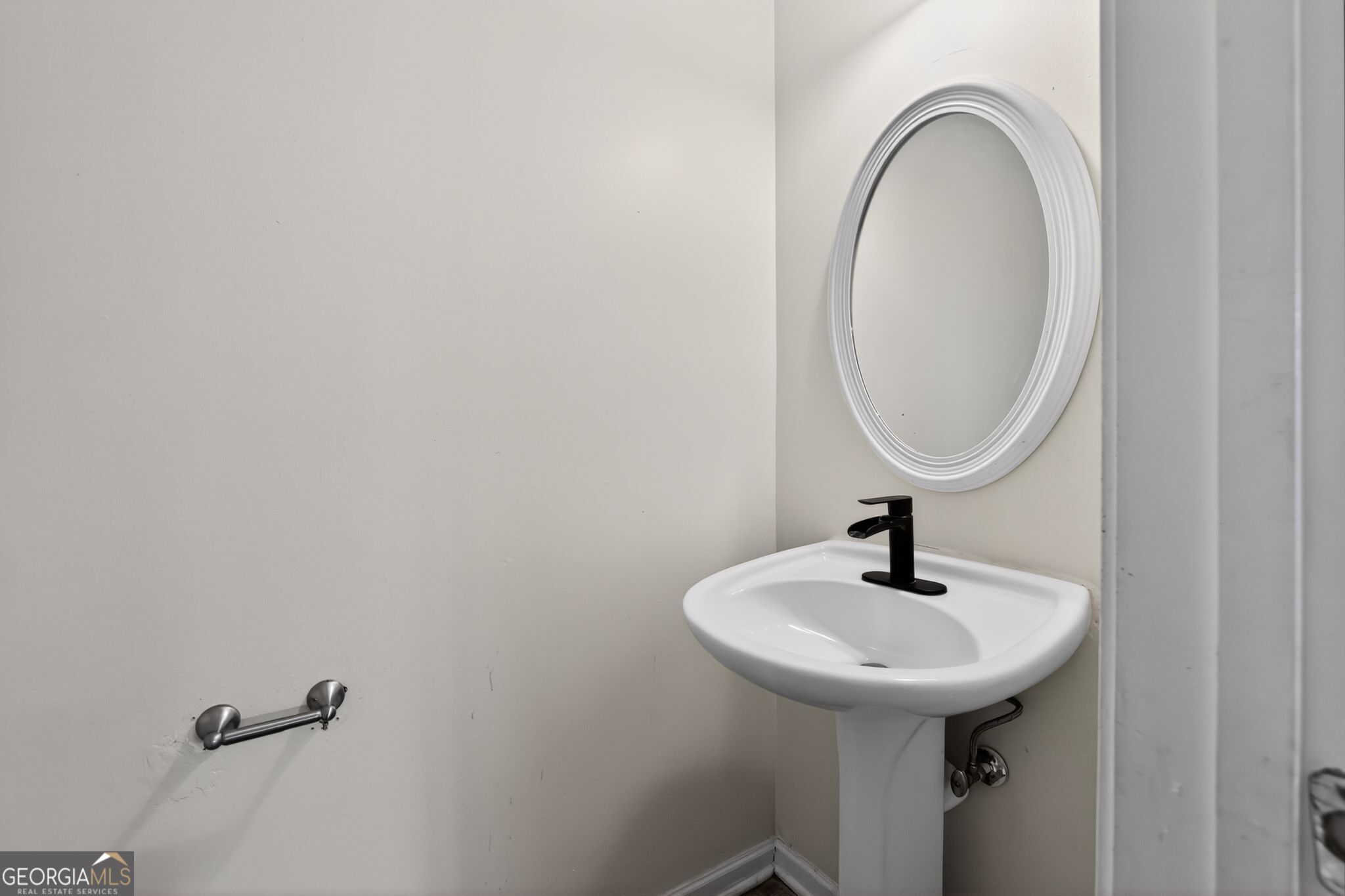 4375 Conley Landing Conley, GA 30288 - Photo 28 of 34 a bathroom with a sink and a mirror