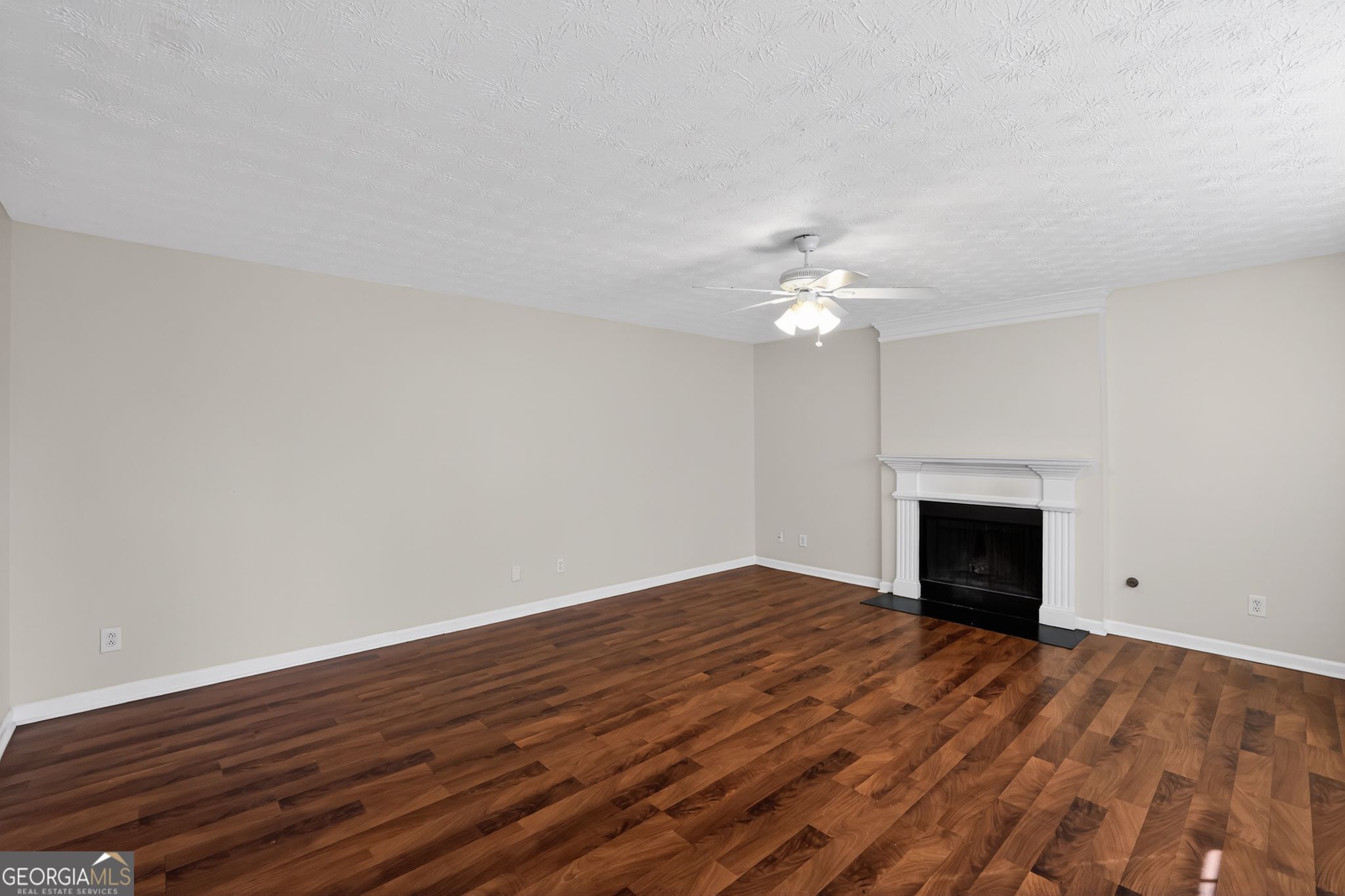 4375 Conley Landing Conley, GA 30288 - Photo 8 of 34 a view of an empty room with wooden floor fireplace and a window