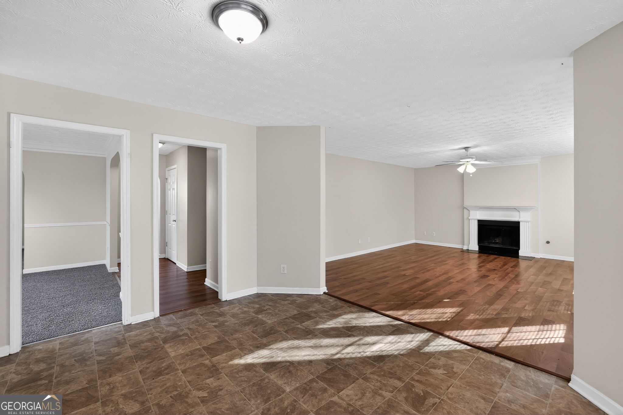 4375 Conley Landing Conley, GA 30288 - Photo 9 of 34 a view of empty room with kitchen and fireplace