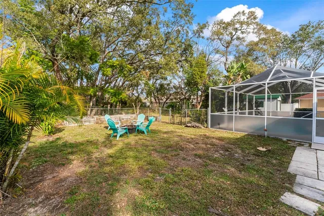 a view of a house with backyard porch and sitting area
