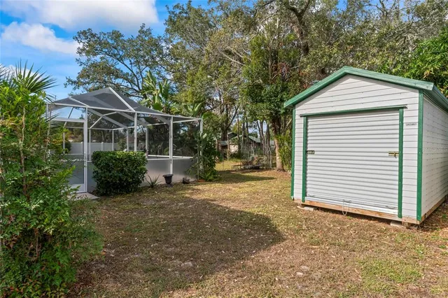 a view of a house with a yard and garage