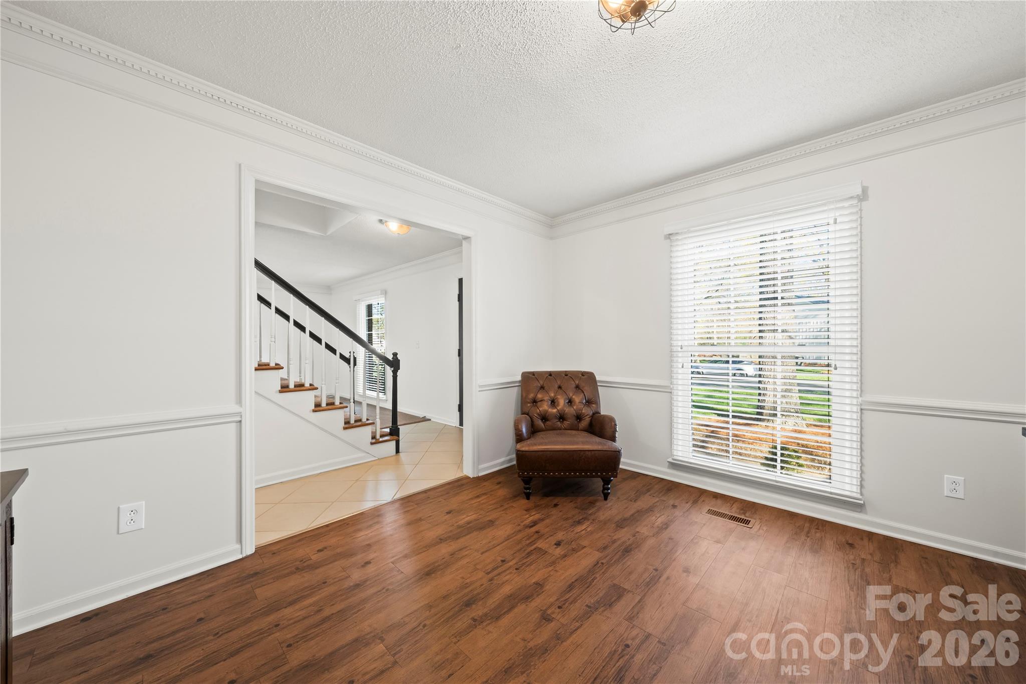 6101 Boykin Spaniel Road Charlotte, NC 28277 - Photo 11 of 40 a view of empty room with wooden floor and fan